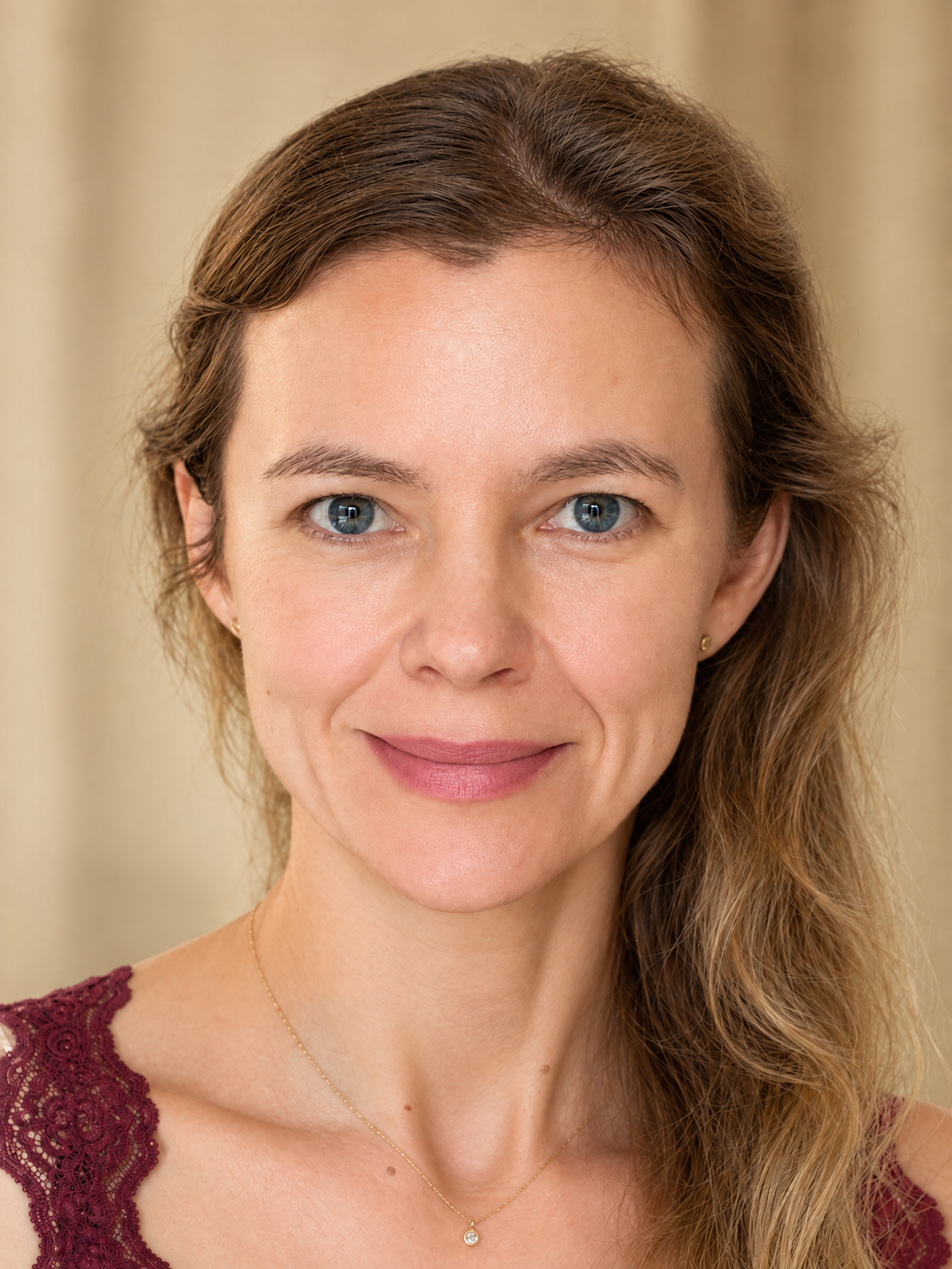 Close-up portrait of Dr. Kasia Wezowski with naturally luminous skin